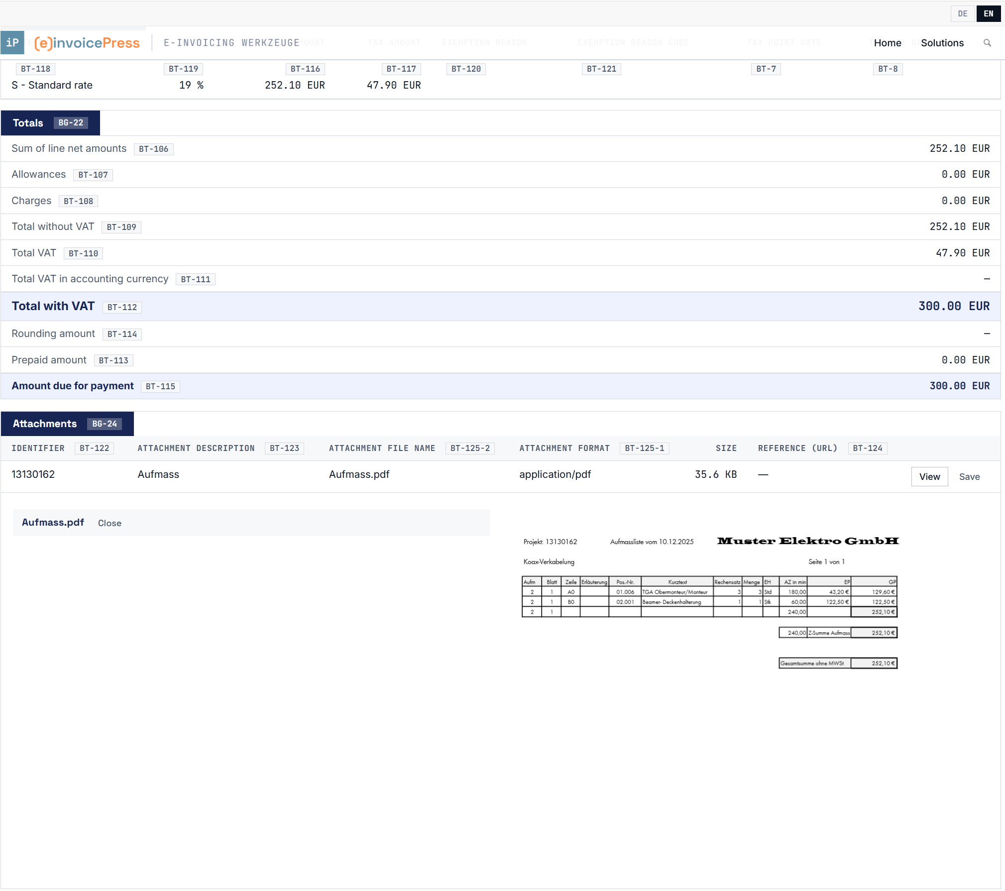 The Attachments section below the invoice with an opened PDF attachment.
